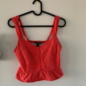 Adorable thrifted top with a little ruffle at the bottom. Too small for me now.